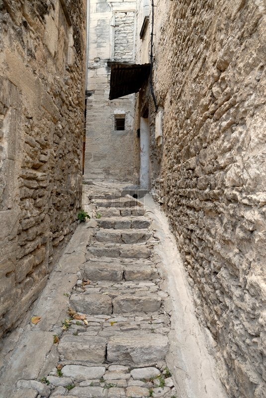 Narrow street in medieval town Gordes, | Stock image