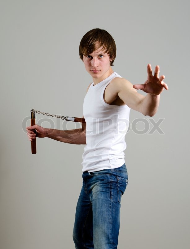 Martial Art Man with nunchucks Stock Photo Colourbox