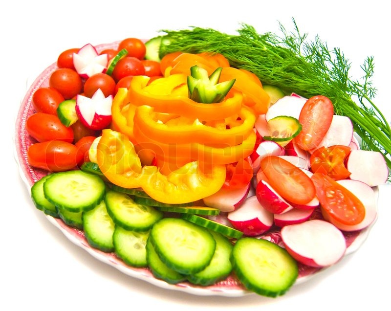 Different Vegetables On A Plate On White Different Vegetables On A Plate On White Stock Photo