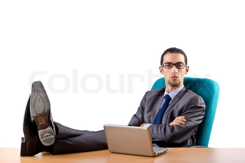 Businessman sitting at the desk | Stock Photo | Colourbox