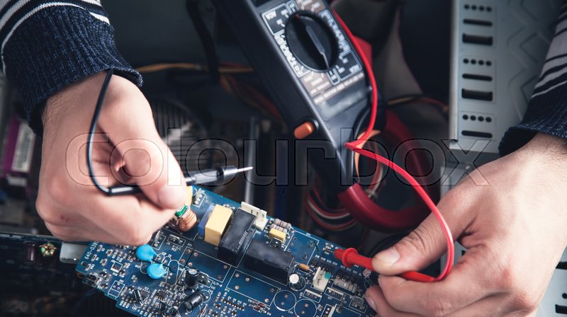 Man checking computer with a ... | Stock image | Colourbox