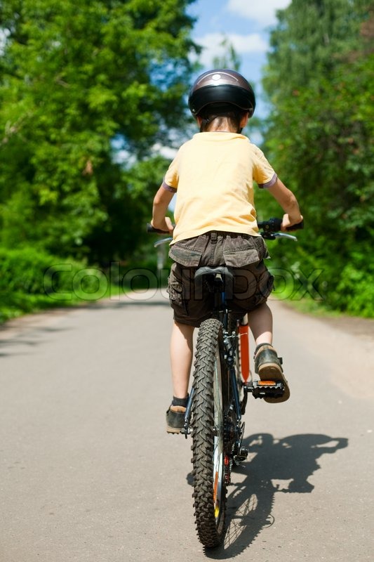 kid riding bicycle