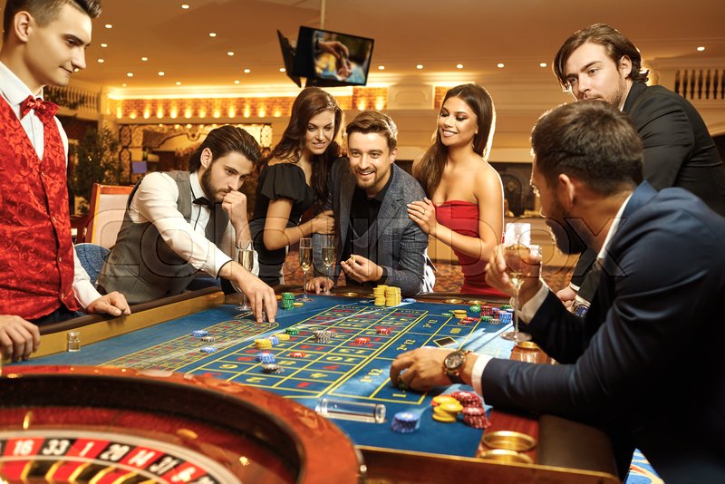 Happy people gambling poker roulette in ... | Stock image | Colourbox