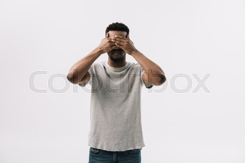 African american man covering eyes ... | Stock image | Colourbox