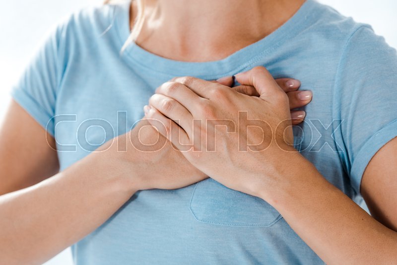 Cropped view of woman touching chest at Stock image Colourbox