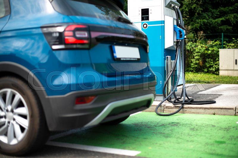 Electric car on gas station. Blue car Stock image Colourbox