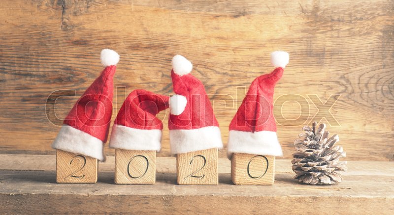 Four wooden blocks with hats of Santa | Stock image | Colourbox