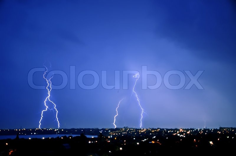 Lightning strike over dark blue sky in ... | Stock image | Colourbox