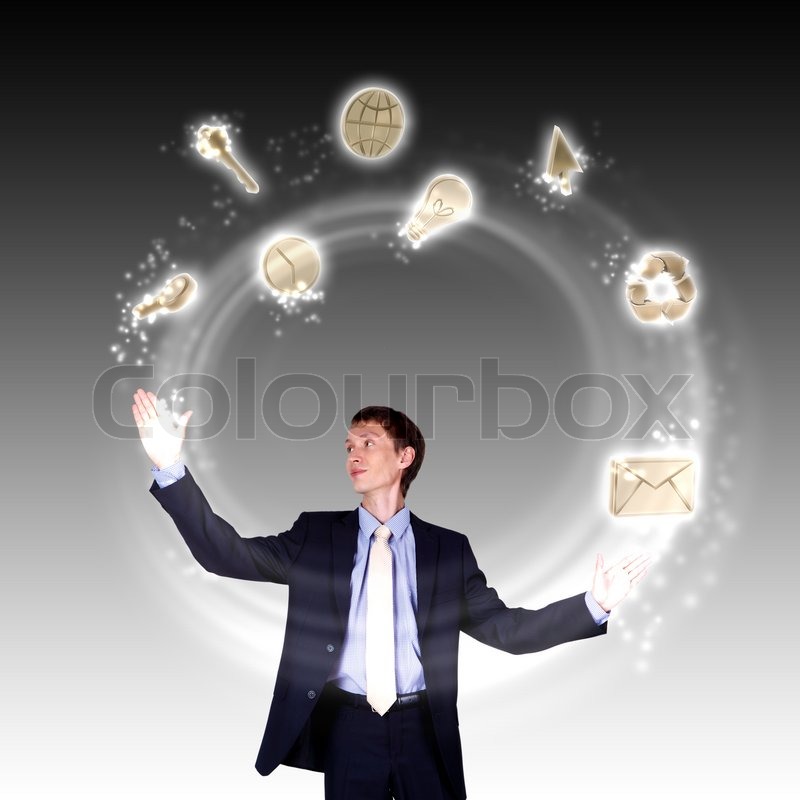 Business man juggling with numbers and symbols Stock Photo Colourbox