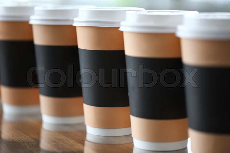 Paper cup line standing at table ready ... | Stock image | Colourbox