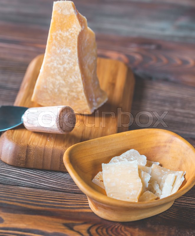Parmesan cheese on the black stone Stock image Colourbox