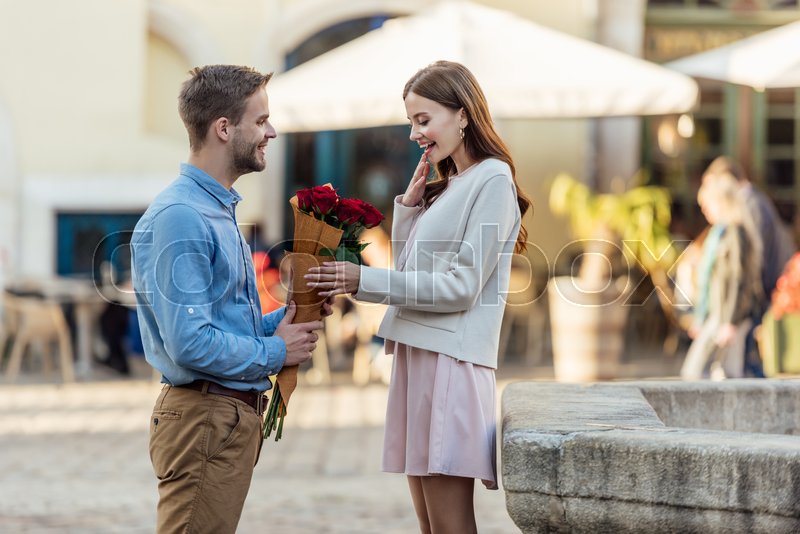 Man Among Roses A Man Giving Roses To A Girl