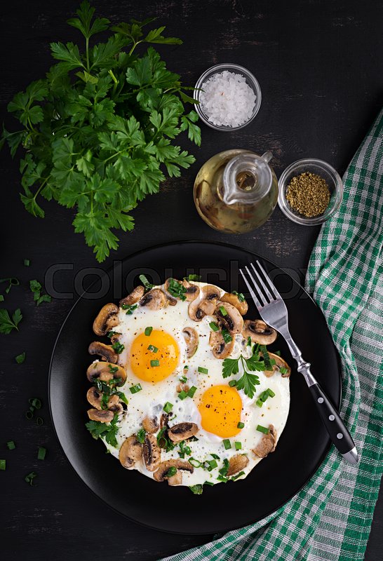 Fried egg, mushrooms and spinach. Keto, Stock image Colourbox