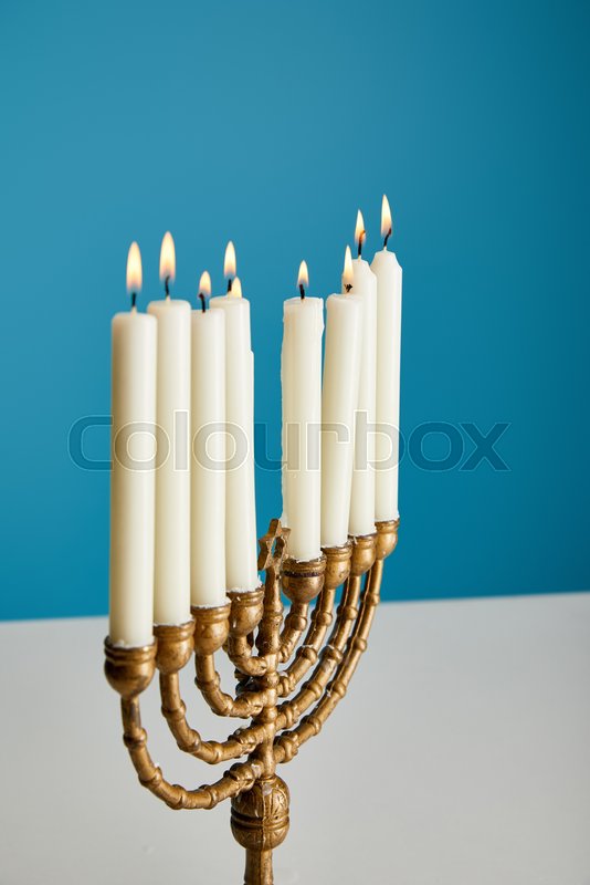 Burning candles in menorah isolated on Stock image Colourbox