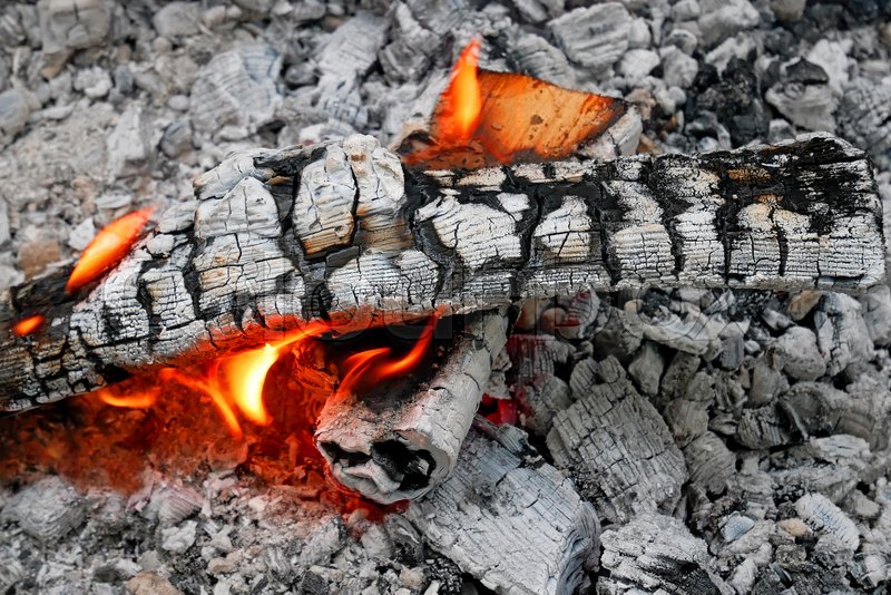 A pile of firewood burns on the Stock image Colourbox