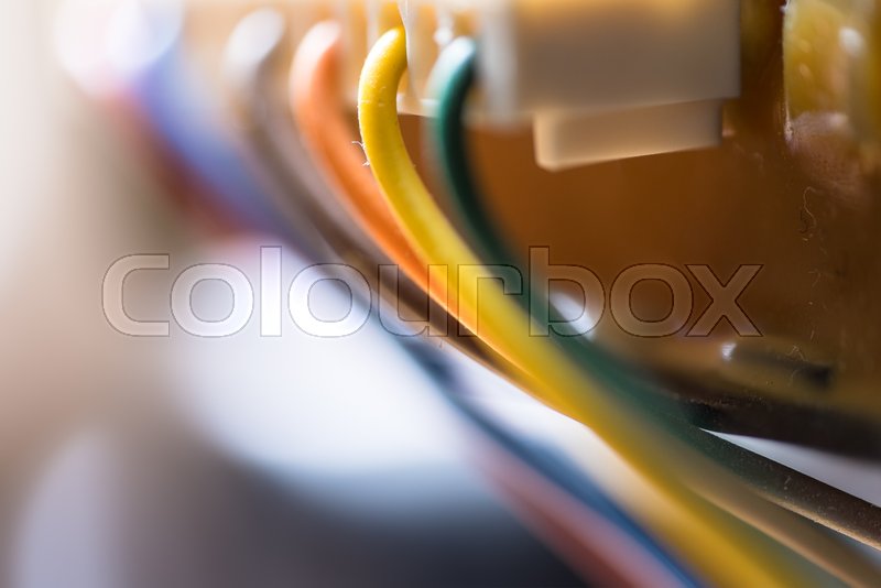 Colored power cables that come from a Stock image Colourbox