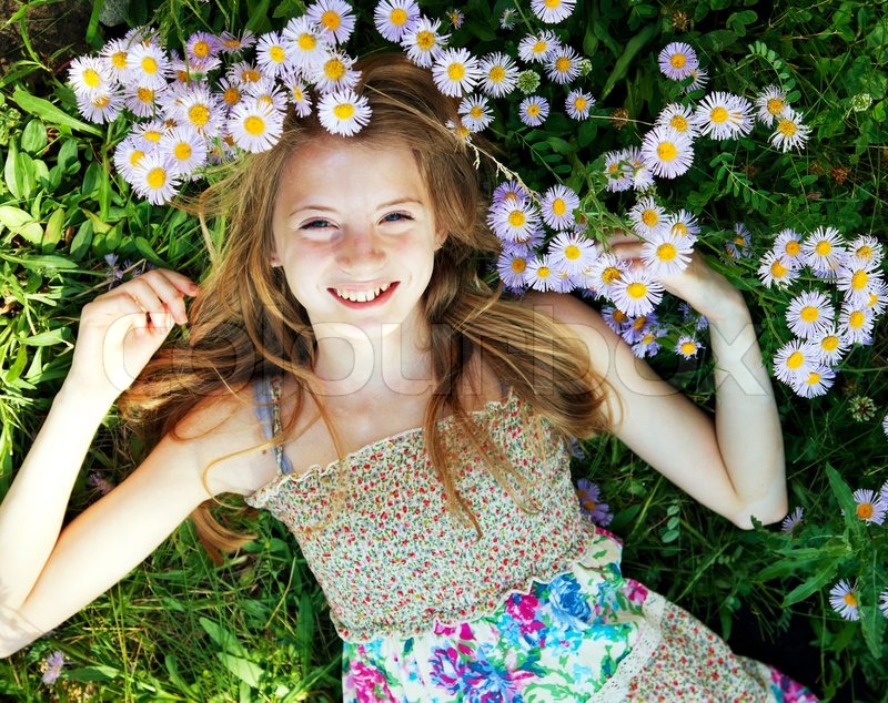 girl laying in grass