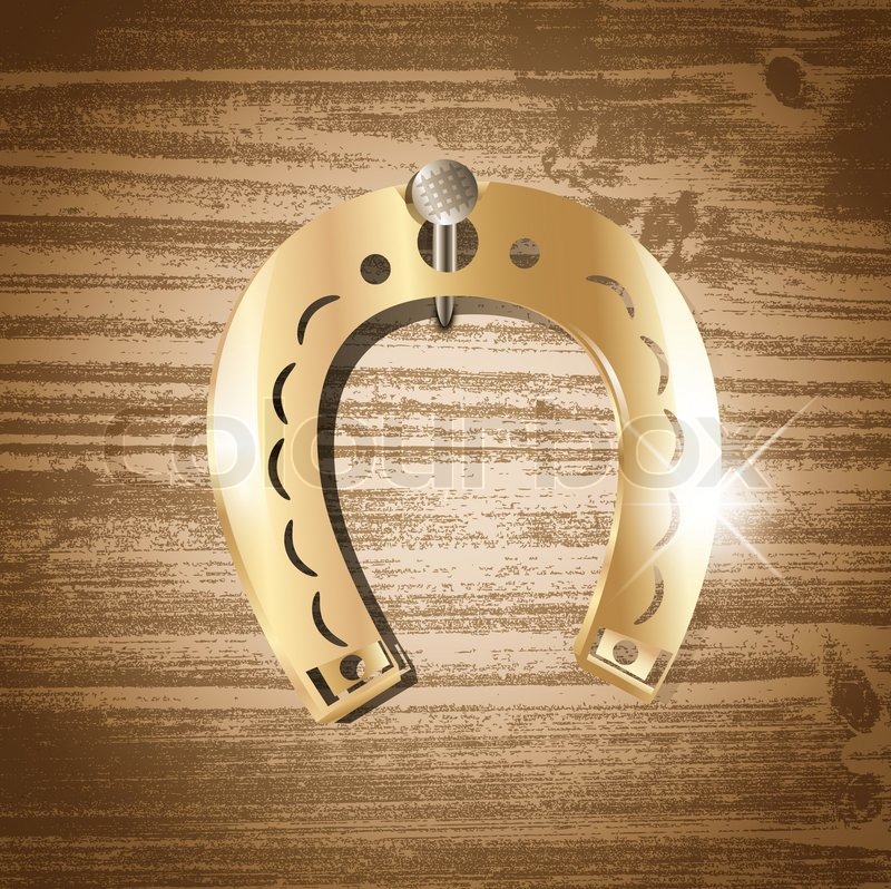 Horseshoe over wooden background | Stock image | Colourbox
