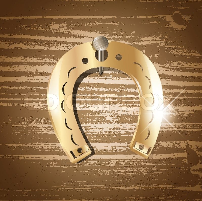 Horseshoe over wooden background | Stock vector | Colourbox