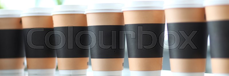 Line of paper cups standing at table ... | Stock image | Colourbox