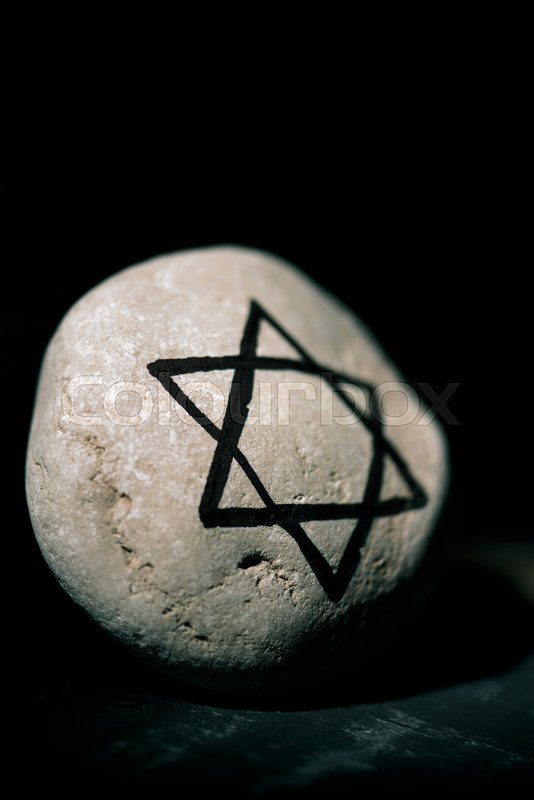 Closeup of a stone with a star of david | Stock image | Colourbox