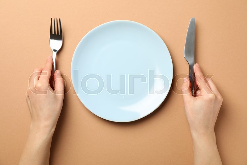 Female hands hold fork and knife on Stock image Colourbox