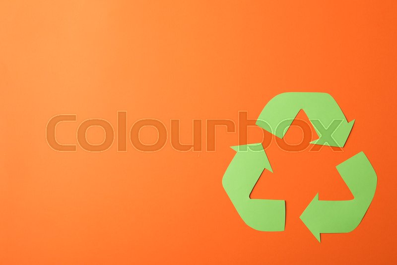 Recycling sign on orange background, ... | Stock image | Colourbox