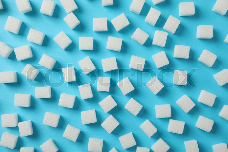 Sugar cubes on blue background, top | Stock image | Colourbox