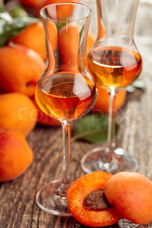 Apricot liquor and fresh apricots on a Stock image Colourbox