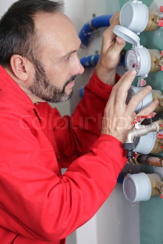 A man and water meter installer Stock image Colourbox