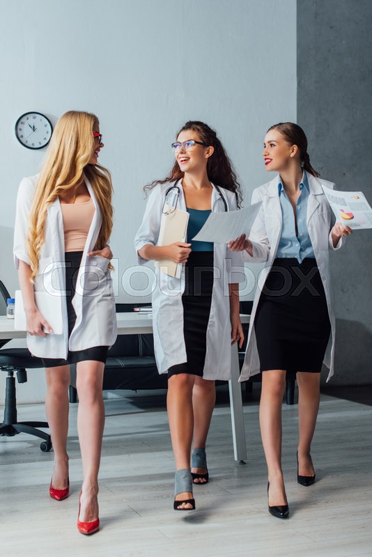 Happy and sexy nurses in white coats Stock image Colourbox