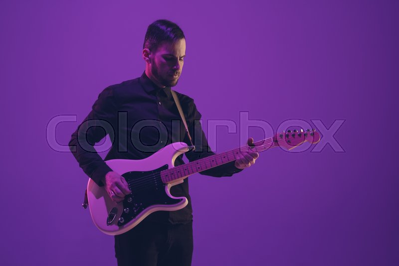 Young and joyful caucasian musician | Stock image | Colourbox