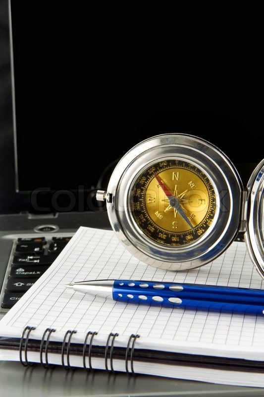 Pen and compass on notebook laptop | Stock image | Colourbox