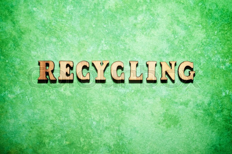 Recycling word on a green paper. Stock image Colourbox