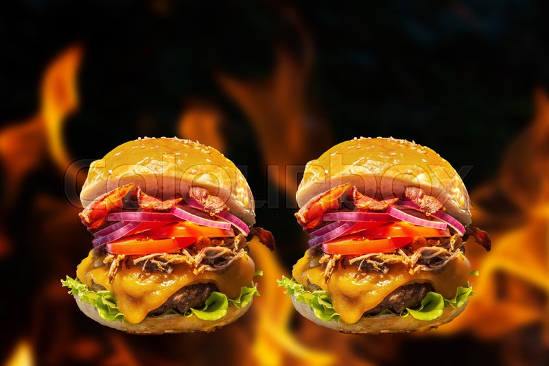 Closeup of home made burgers with fire Stock image Colourbox