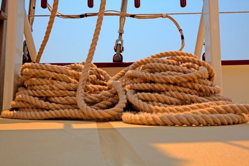 Coiled rope rigging on a sailboat deck | Stock image | Colourbox