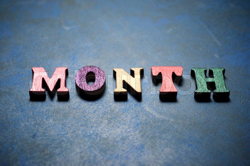 Month word on a blue table. Stock image Colourbox