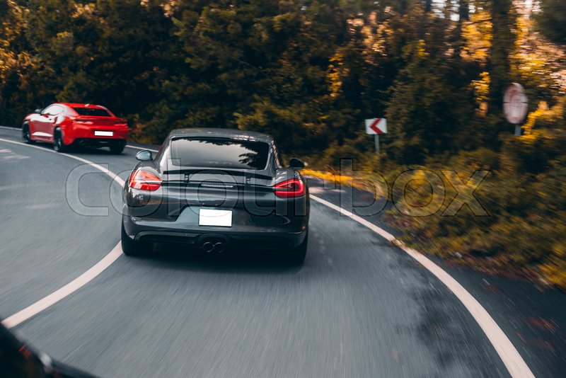 Sport supercars racing on the forest ... | Stock image | Colourbox