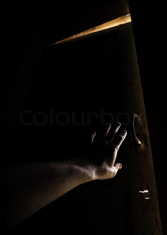 Open Door Dark Room hand of a man trying to open old door and escape from the dark Open Door Dark Room hand of a man trying to open old door and escape from the dark