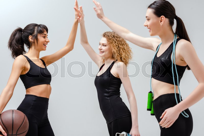 Happy multicultural girls in sportswear ... | Stock image | Colourbox