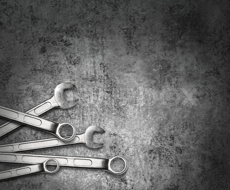 Spanner wrench  tools  on grunge silver Stock image 