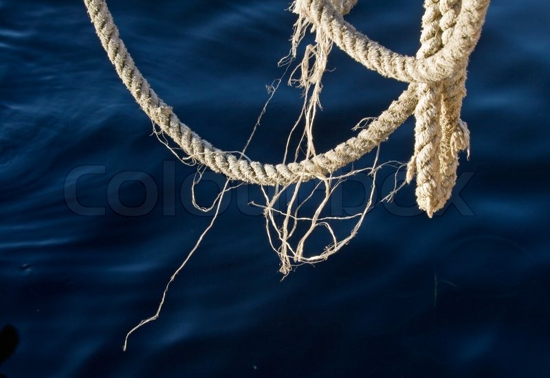 Nautical rope with deep blue water on ... | Stock image | Colourbox