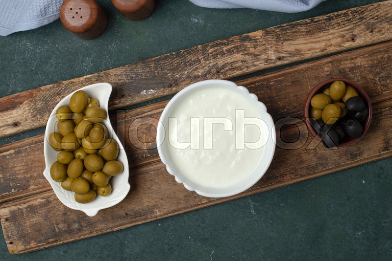 Marinated olives and a bowl of yogurt Stock image Colourbox