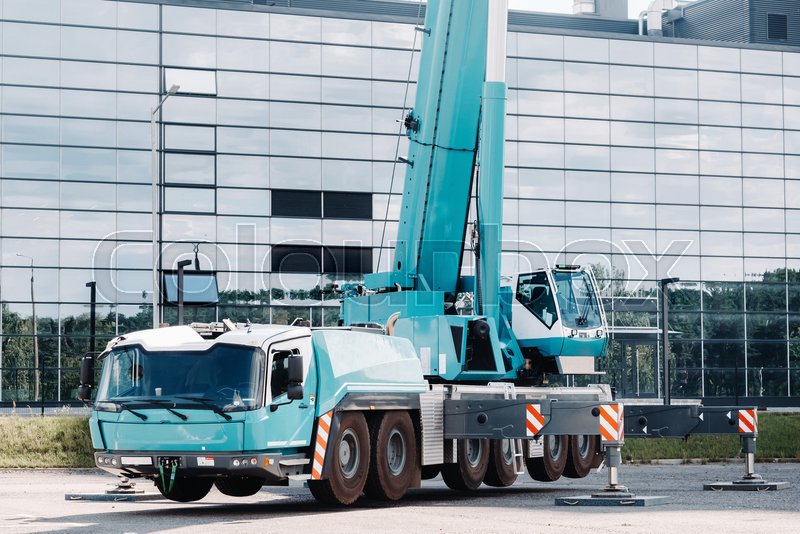 A large blue truck crane stands ready Stock image Colourbox