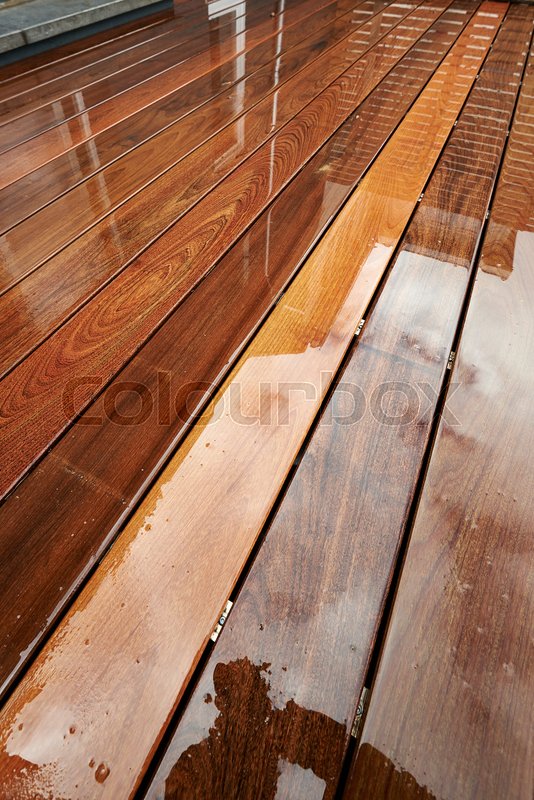Wet hardwood floor on patio in exterior Stock image Colourbox