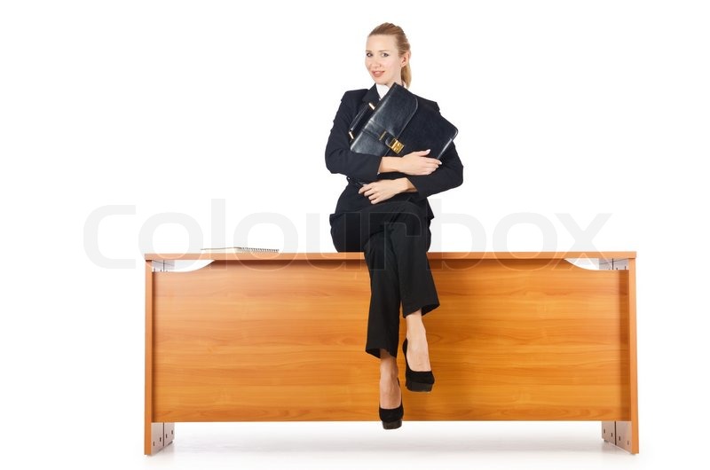 Woman businesswoman sitting on the desk | Stock Photo | Colourbox