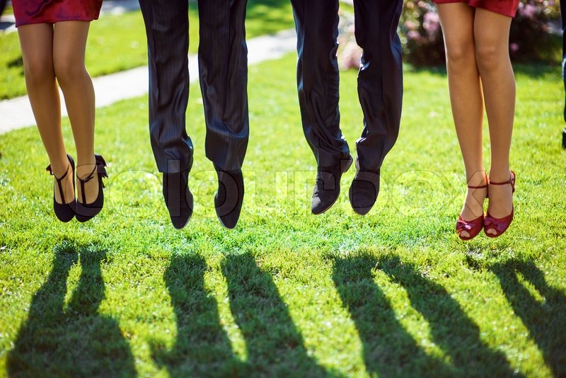 Feet of people who jump Stock image Colourbox