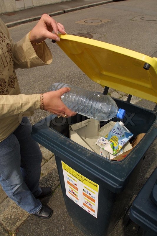 Download Woman throwing plastic bottles in garbage bin | Stock ... Yellowimages Mockups