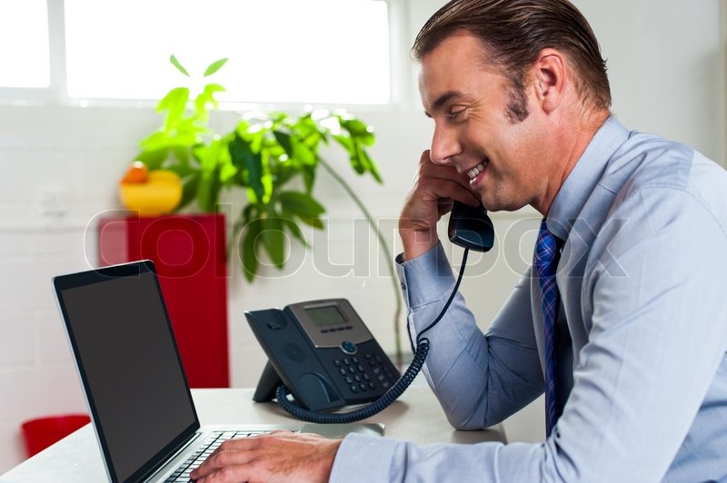 Side Profile Of A Businessman Busy In Office Work Side Profile Of A Businessman Busy In Office Work