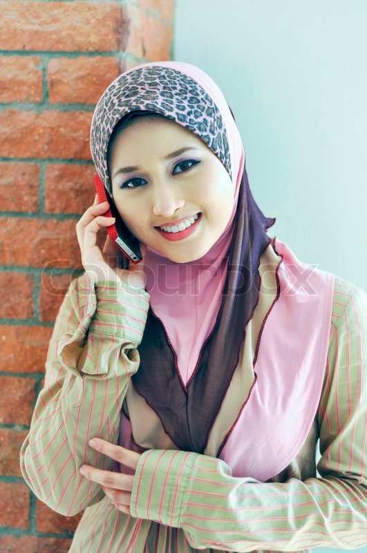 Pretty Muslim girl make a phone call  Stock Photo  Colourbox